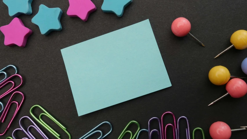 a bunch of paper clips sitting on top of a table, a child's drawing, pexels contest winner, turquoise color scheme, chalkboard, rectangle, starry