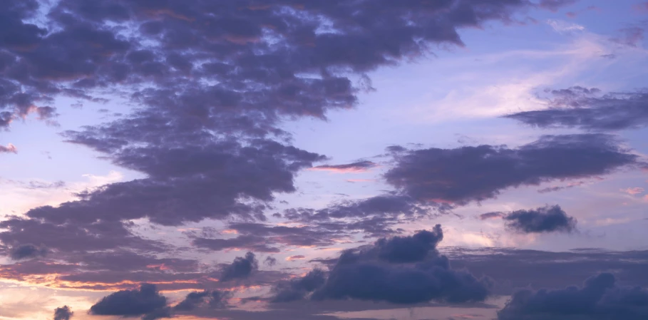 a large body of water under a cloudy sky, an album cover, unsplash, romanticism, violet sky, late summer evening, major arcana sky, detailed sky