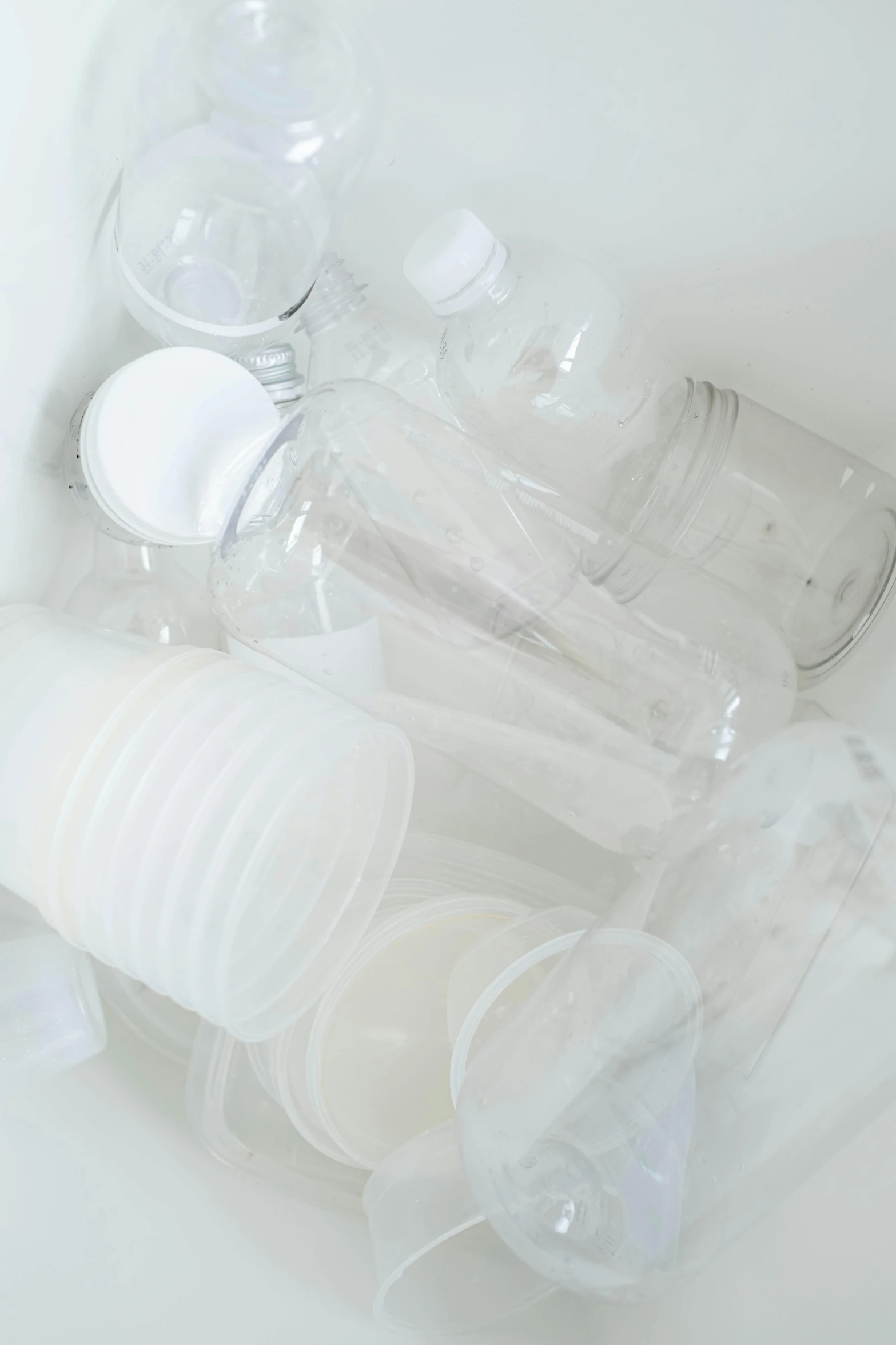 a white sink filled with plastic cups and toothbrushes, inspired by Rachel Whiteread, unsplash, plasticien, detail, translucent sss xray, ilustration, disassembled