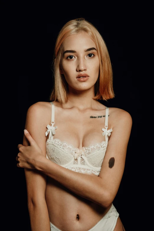 a woman in a white lingerie posing for a picture, a colorized photo, inspired by Elsa Bleda, dua lipa, croptop, blonde crea, thin aged 2 5