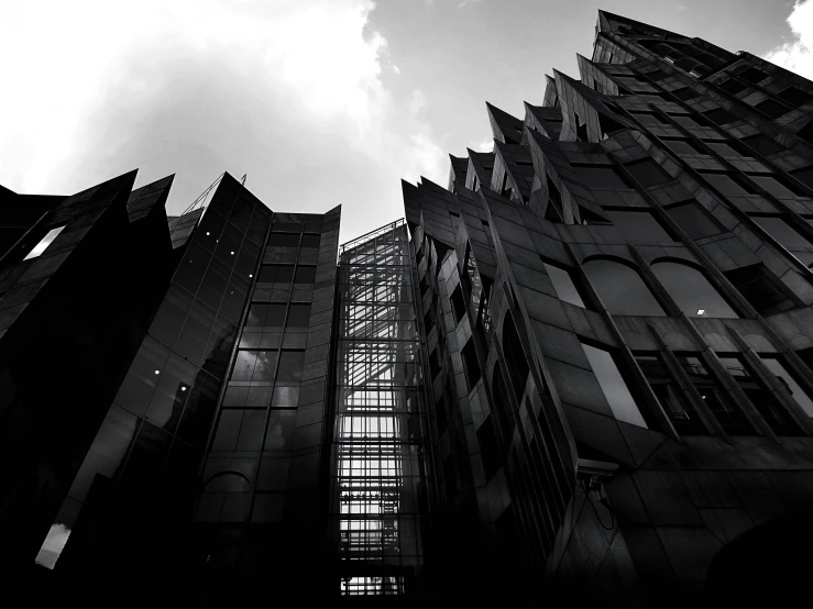 a black and white photo of a tall building, inspired by Zaha Hadid, flickr, in empty!!!! legnica, jagged metal landscape, glass houses, dark gothic cathedral