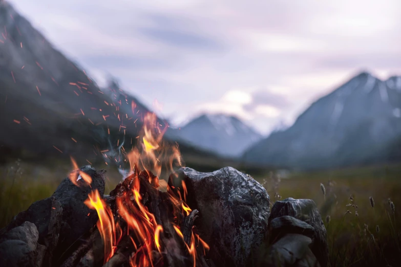 a campfire with mountains in the background, pexels contest winner, visual art, cinematic detail, avatar image, spring season, multiple stories