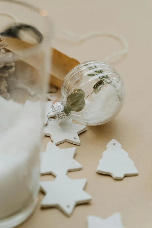 a glass of milk sitting on top of a table, fossil ornaments, bespoke, botanical, light scatter