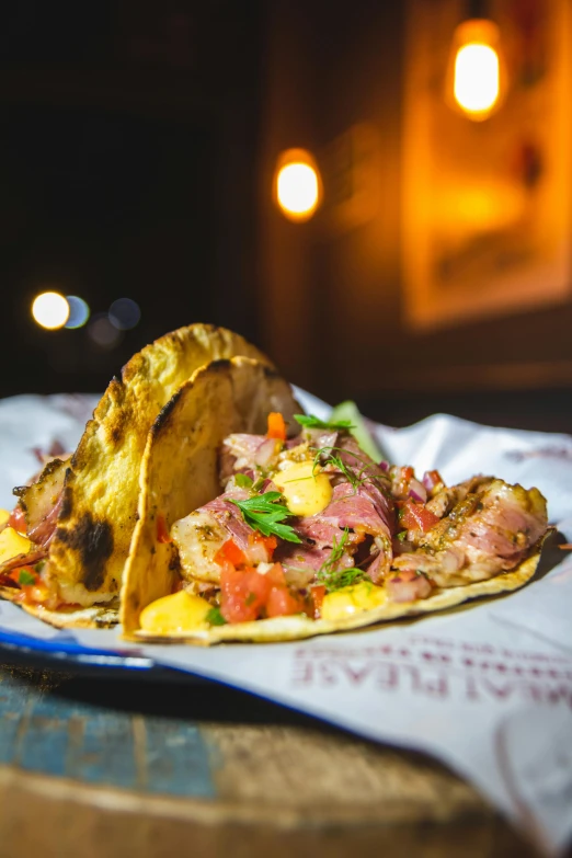 a close up of a plate of food on a table, by Drew Tucker, tacos, lit from the side, thumbnail, aruba