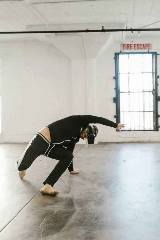 a man doing a handstand in a dance studio, a hologram, unsplash, video art, vr helmet, full body with costume, burned, square