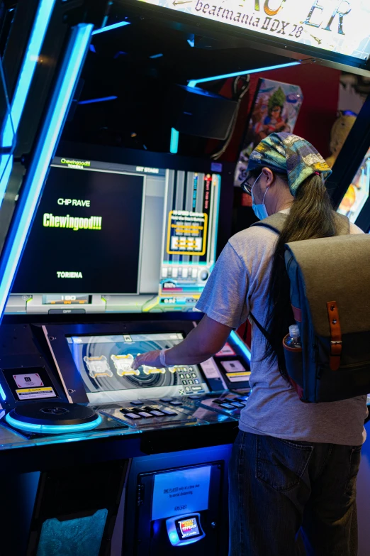 a woman standing in front of a video game machine, taken in 2022, a man wearing a backpack, inside a casino, 2 5 6 x 2 5 6 pixels