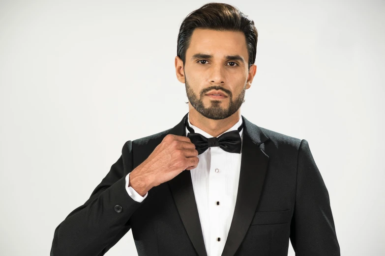 a man in a tuxedo adjusting his bow tie, inspired by Ramon Pichot, les nabis, dressed in a jodhpuri suit, ray william johnson, profile image, thumbnail