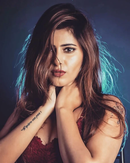 a woman in a red dress posing for a picture, an album cover, inspired by Elsa Bleda, trending on instagram, graffiti, provocative indian, by :5 sexy: 7, handsome girl, lovingly looking at camera