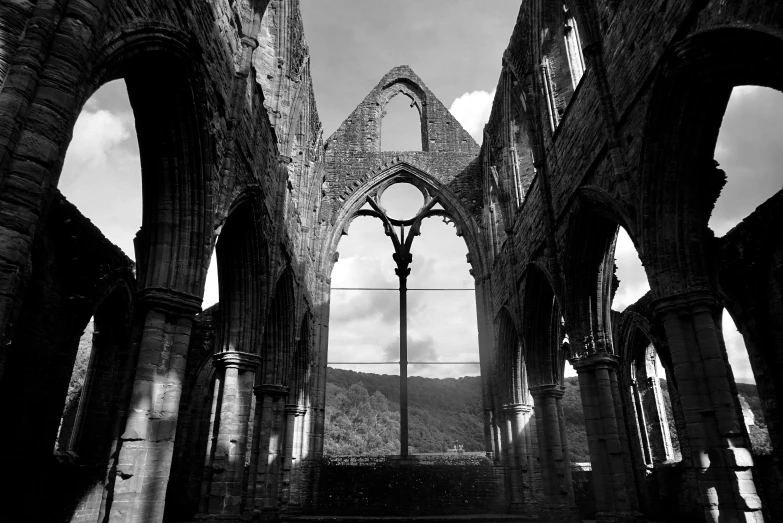 a black and white photo of the inside of a church, by Robin Guthrie, pexels contest winner, gothic art, ruins landscape, overlooking, pittsburgh, beautiful surroundings