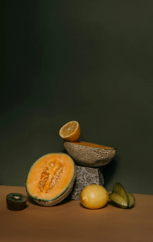a couple of melons sitting on top of a table, a still life, unsplash, digital image, various posed, stacked image, yellow orange