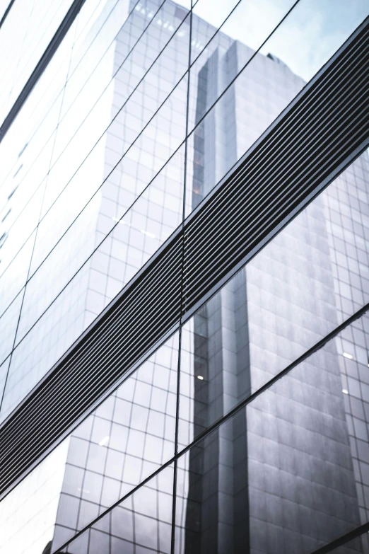 a black and white photo of a tall building, inspired by Tadao Ando, pexels contest winner, transparent corrugated glass, reflective gradient, vivid lines, buildings photorealism