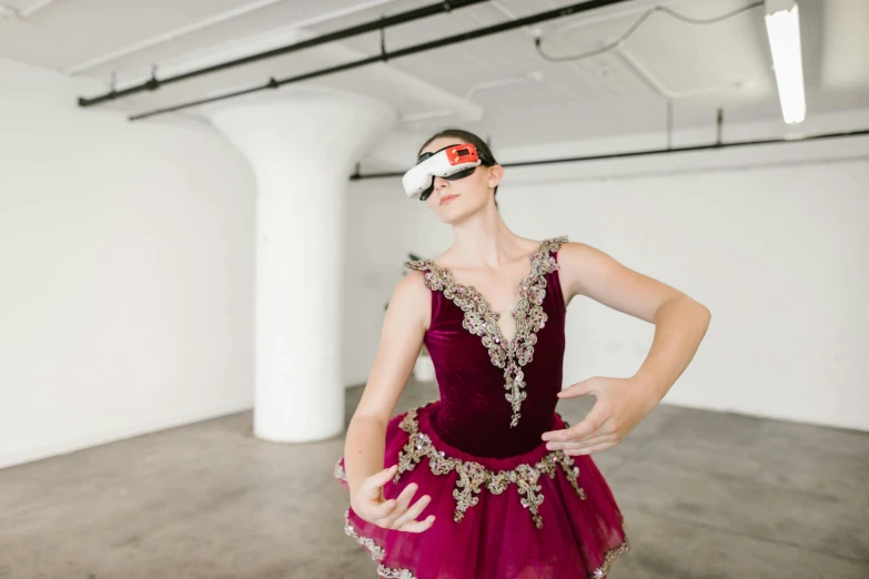 a woman standing in a room with a mask on her face, inspired by Elizabeth Polunin, wearing vr goggles, dressed as a ballerina, lachlan bailey, ar glasses