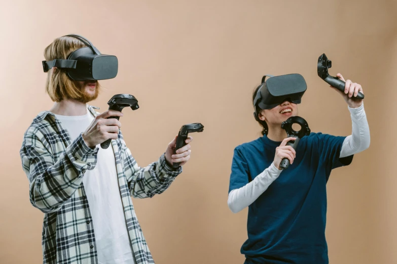 a man and a woman wearing virtual reality headsets, by Carey Morris, trending on pexels, inside a rpg game, plain background, group photo, controllers