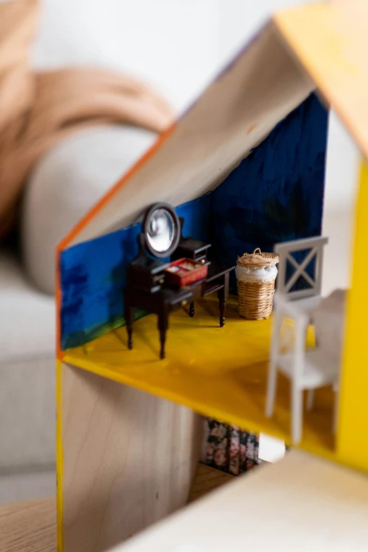 a doll house sitting on top of a table, a picture, unsplash, conceptual art, detail shot, cut-away, ikea, a brightly coloured