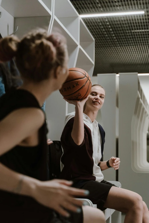 a group of people playing a game of basketball, greta thunberg smiling, alessio albi, fzd school of design, woman holding another woman