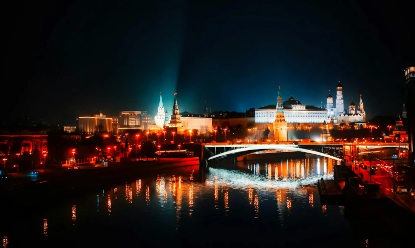 a view of a bridge over a river at night, pexels contest winner, socialist realism, moscow kremlin, red black white golden colors, city skyline, screensaver