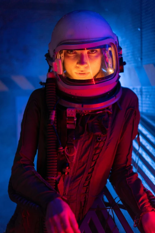 a woman in a space suit sitting on a bench, light and space, intense lighting, inside the tardis, immersive, february)