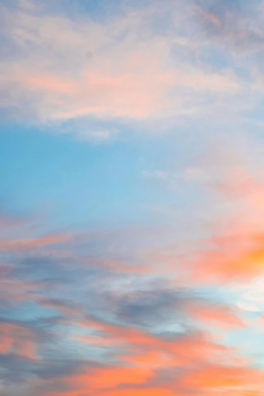 a plane that is flying in the sky, by Sven Erixson, unsplash, romanticism, pastel blues and pinks, pastel orange sunset, abstract photography, light blues