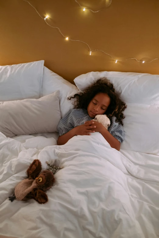 a little girl laying in bed with a teddy bear, by Alice Mason, comfy lighting, checking her phone, ikea, premium quality