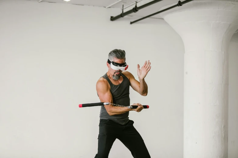 a man in a black shirt holding a baseball bat, inspired by Liao Chi-chun, interactive art, goggles on forehead, action with run and fight, profile image