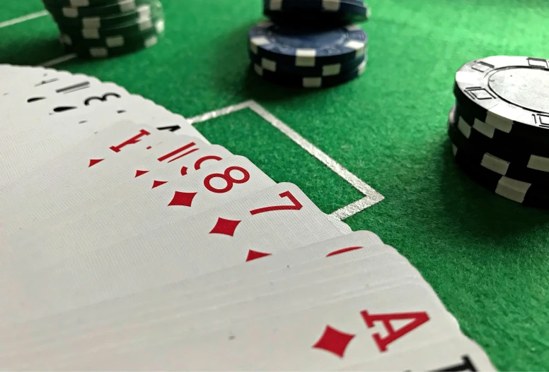 a close up of playing cards and chips on a table, a screenshot, by Tom Wänerstrand, pexels contest winner, instagram picture, tiny details, sports photo, thumbnail