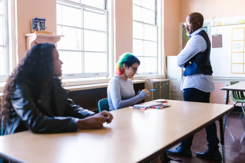 a group of people sitting around a table, pexels contest winner, ashcan school, man sitting facing away, standing in class, sitting in dean's office, mental health