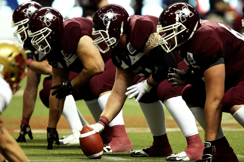 a group of young men playing a game of football, a digital rendering, reddit, maroon and white, 🇺🇦, quebec, plus-sized