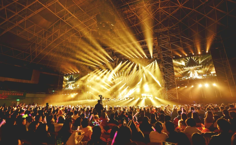 a large crowd of people at a concert, pexels contest winner, set on singaporean aesthetic, lightshow, yellow lighting from right, 2 0 2 2 photo