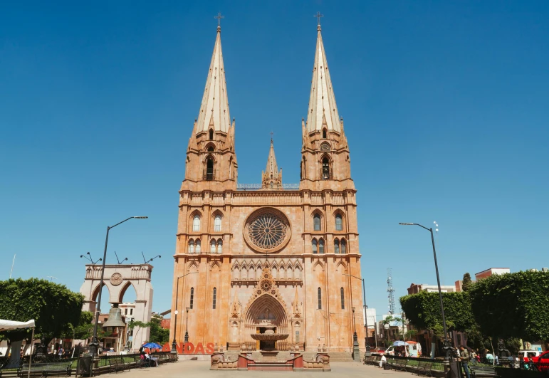 a large cathedral with two spires in front of a blue sky, by Matteo Pérez, pexels contest winner, shipibo, pink marble building, 1990s photograph, 3 - piece