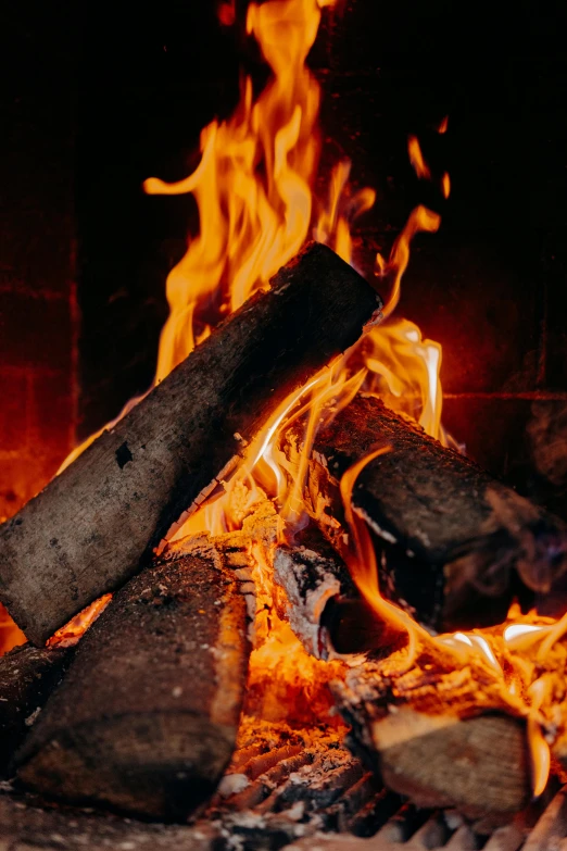 a close up of a fire in a fireplace, pexels contest winner, warm wood, golden embers flying, vanilla, profile image