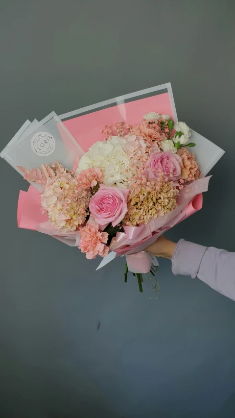 a woman holding a bouquet of pink and white flowers, award-winning crisp details”, adorable design, hydrangea, full product shot