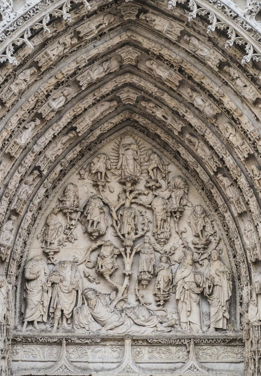 a close up of a building with carvings on it, by Barthélemy d'Eyck, pexels contest winner, romanesque, massive arch, ornate medieval religious icon, frontal picture, carved ivory
