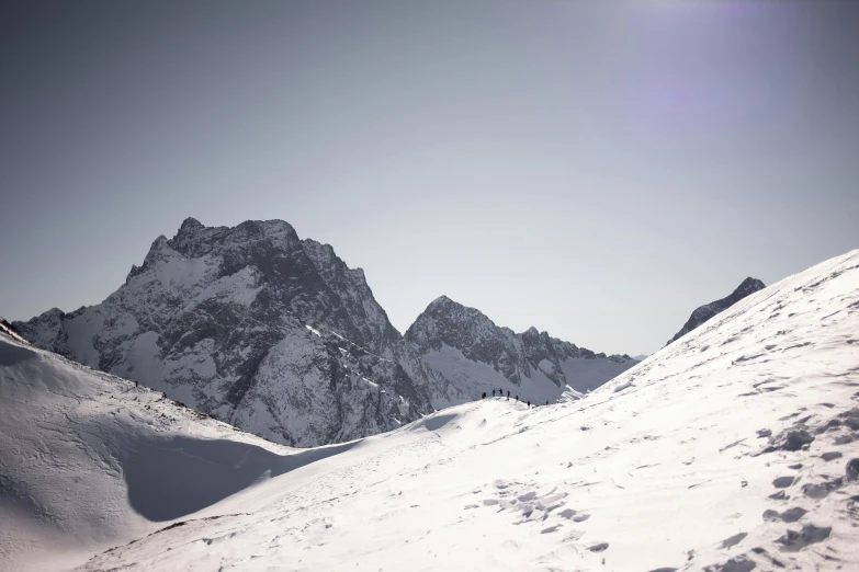 a man riding skis down a snow covered slope, pexels contest winner, les nabis, distant mountain range, slightly minimal, (3 are winter, pyranees