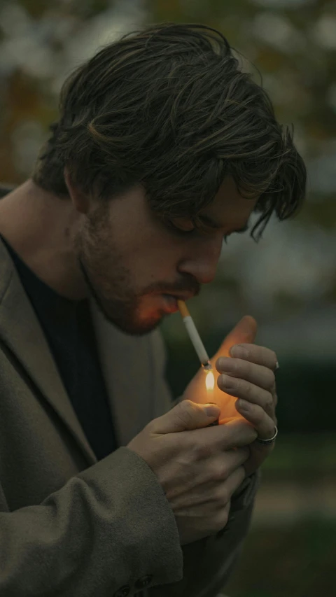 a man lighting a cigarette with a lighter, pexels contest winner, renaissance, adam driver behind, ( ( theatrical ) ), outside alone smoking weed, cinestill eastmancolor