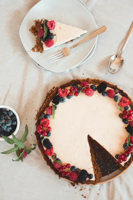 a cake sitting on top of a white table, by Matthias Stom, pexels contest winner, renaissance, eucalyptus, healthy, crust, promo image