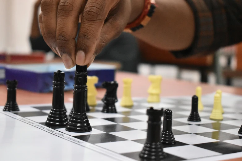 a close up of a person playing a game of chess, curated collections, schools, black hands with black claws, thumbnail