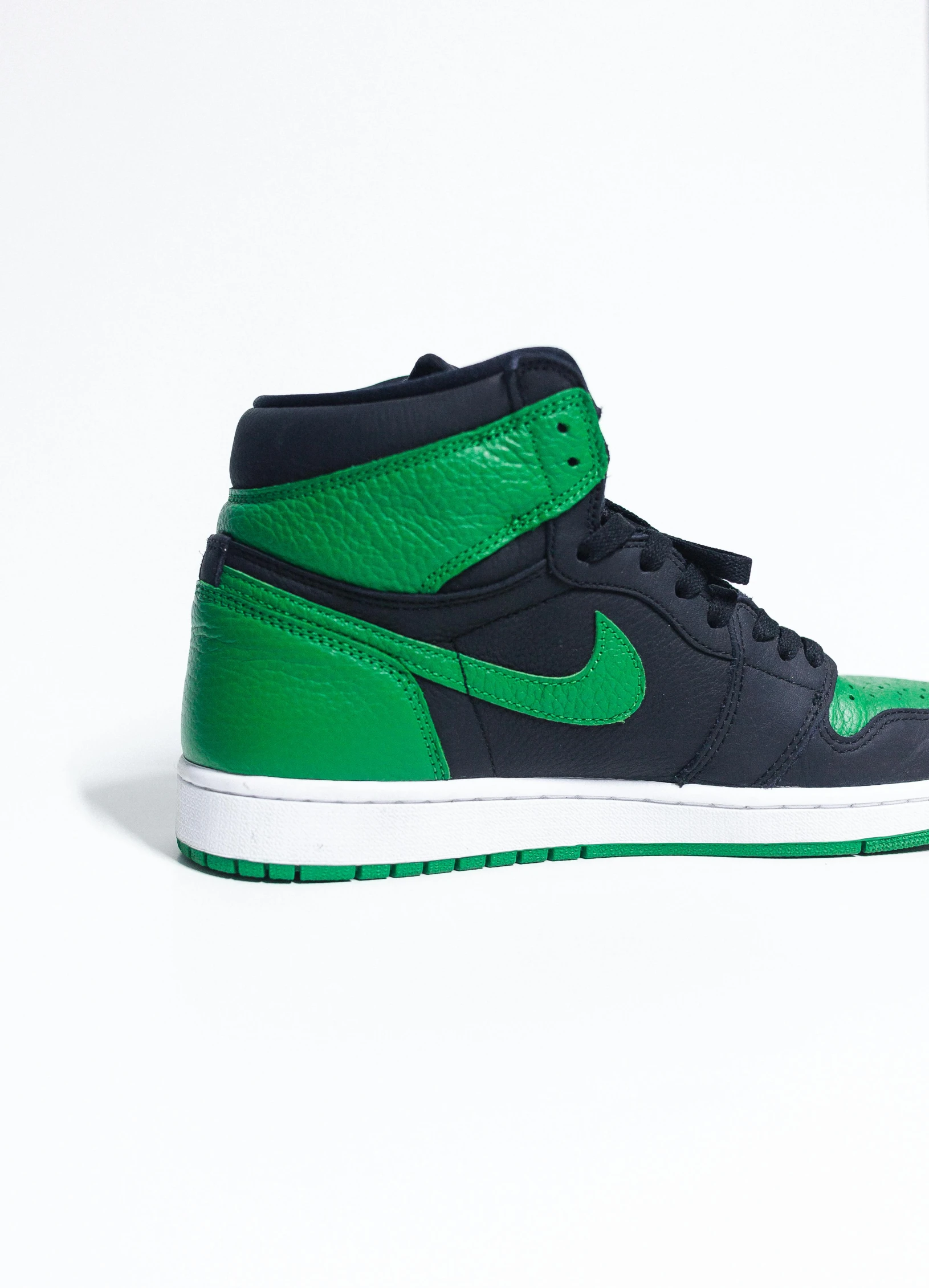 a pair of green and black sneakers on a white surface, an album cover, by Gavin Hamilton, trending on unsplash, air jordan 1 high, side view profile, detailed color scan, grain”