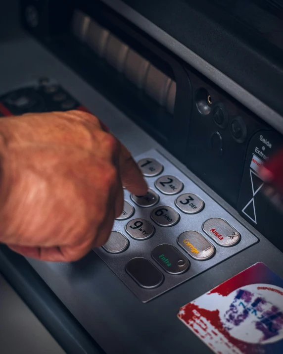 a close up of a person using an atm machine, a digital rendering, pexels contest winner, jerome powell, ariel view, tactile buttons and lights, square