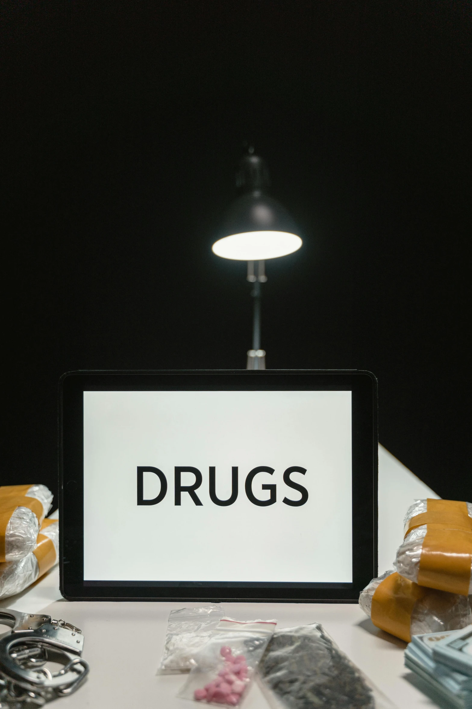 a laptop computer sitting on top of a table, drugs, a labeled, digital image, brown