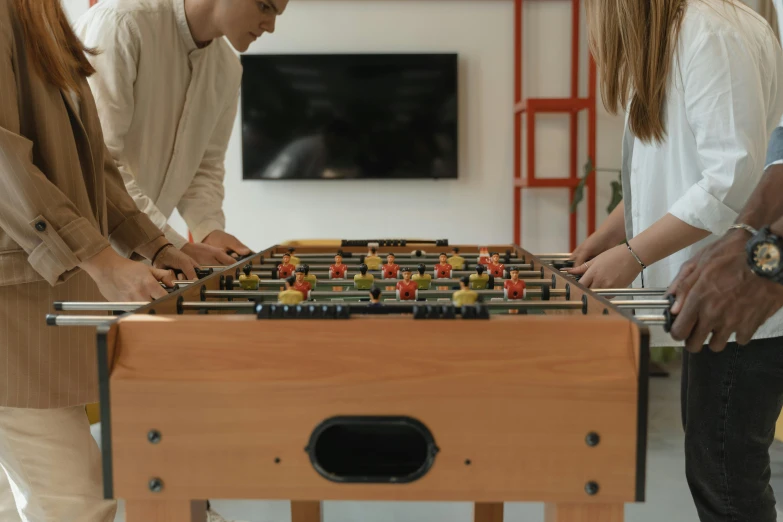 a group of people playing a game of foo foo, trending on pexels, hyperreal highly detailed 8 k, sports setting, brown, tabletop