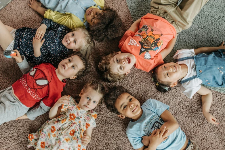 a group of children laying on the floor together, by Nina Hamnett, pexels contest winner, mixed race, avatar image, 15081959 21121991 01012000 4k, instagram photo