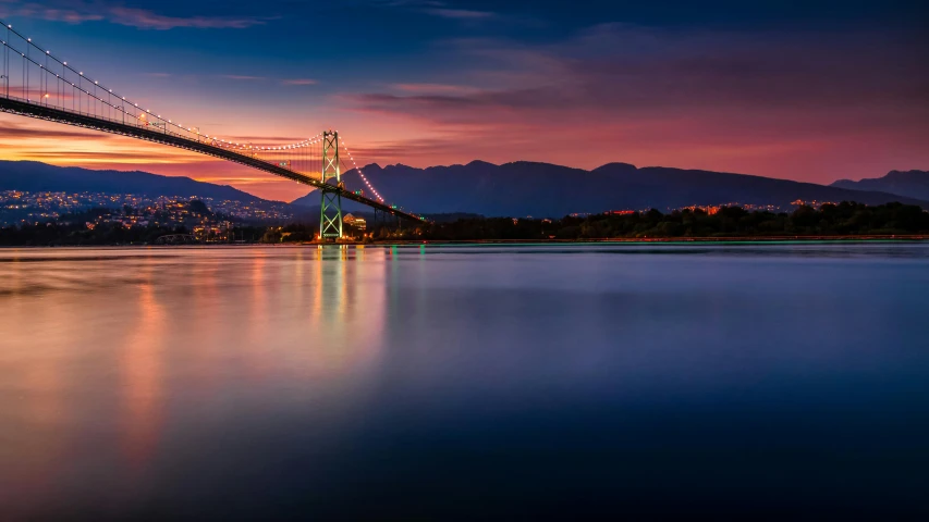 a bridge over a body of water with mountains in the background, by Jacob Burck, pexels contest winner, vancouver school, colorful glow, city bay bridge aqueduct, slide show, reflections in copper