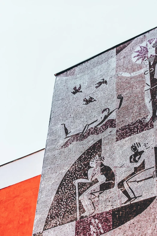 a large mural on the side of a building, by Carey Morris, trending on unsplash, pointillism, russian soviet motifs, promo image, monocolor mosaics, view from below