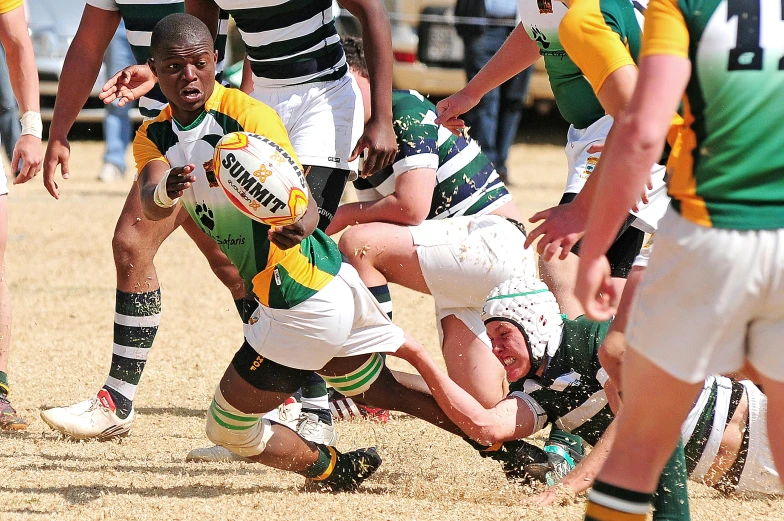 a group of men playing a game of rugby, green and gold, up close picture, facebook photo, heavy pigment