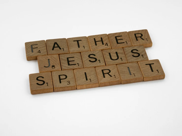 wooden scrabbles spelling the word father jesus spirit, a picture, inspired by Július Jakoby, pexels, 1 6 x 1 6, squares, ad image, mint