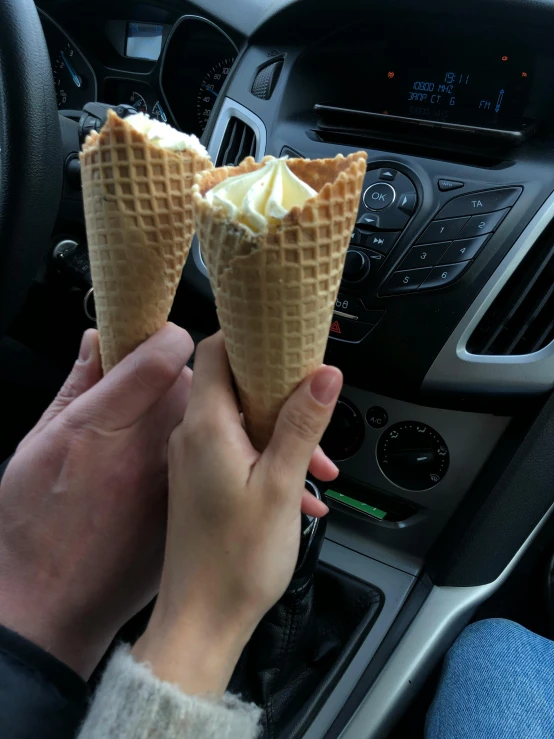 a person holding two ice cream cones in their hands, 😭 🤧 💔, vehicle, cooked, perfect crisp light