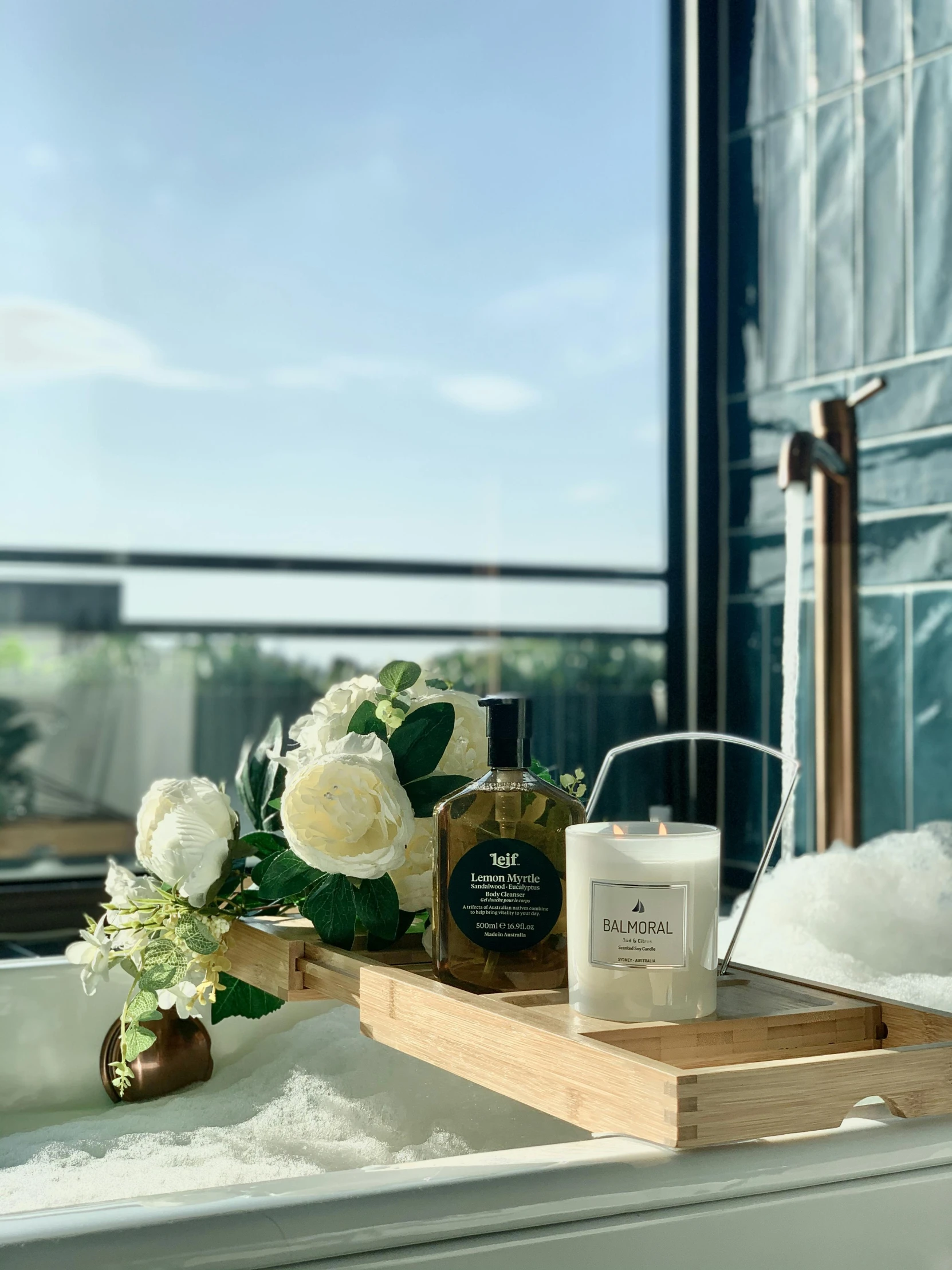 a bath tub sitting in a bathroom next to a window, on a wooden tray, detailed product image, on rooftop, honey