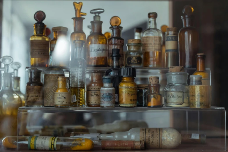 a bunch of bottles that are on a shelf, unsplash, hyperrealism, old scientific documents, healing tubes, fan favorite, brown