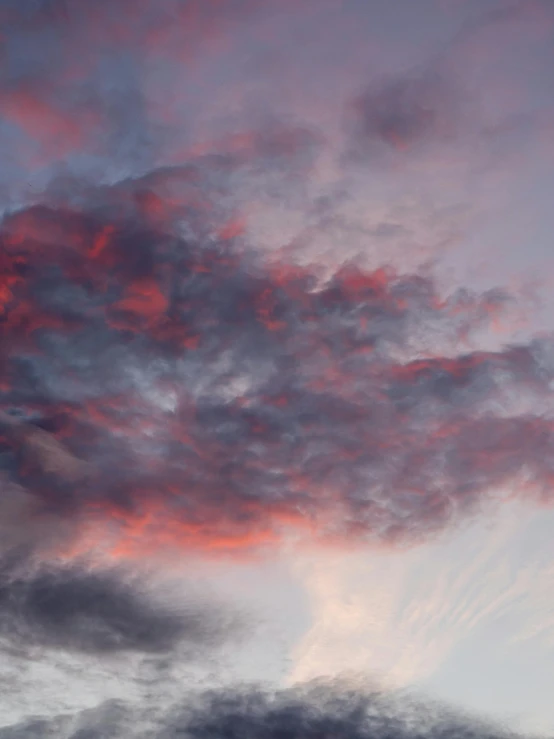 there is a plane that is flying in the sky, a picture, inspired by Frederic Church, pexels contest winner, romanticism, pink and grey clouds, ((sunset)), soft grey and red natural light, cloud nebula