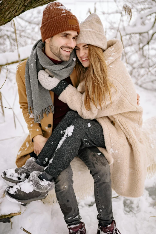 a man and woman sitting on a tree in the snow, trending on pexels, cuddly fur, tan, happy girl, thumbnail